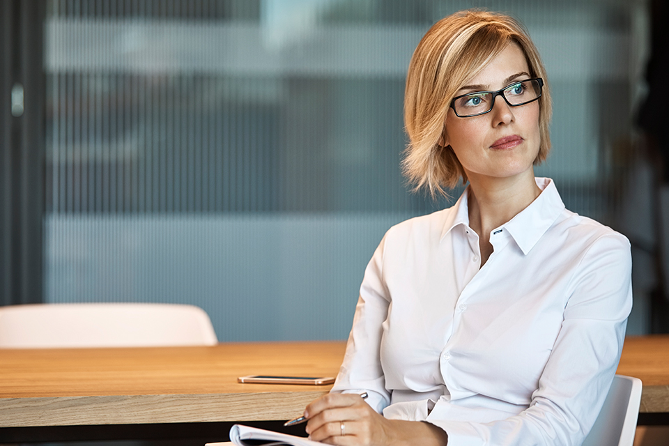 CEO contemplating how she can lead an improvement in operations using energy-efficient solutions