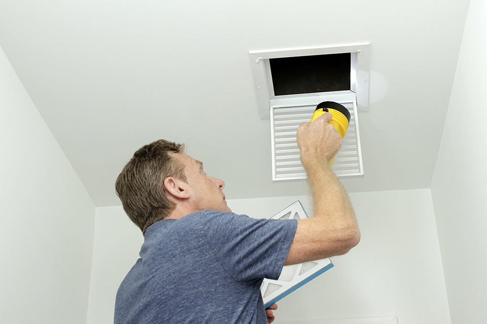 Contractor preparing to clean air ducts
