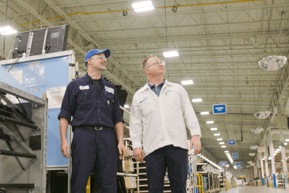 Two gentleman viewing overall warehouse